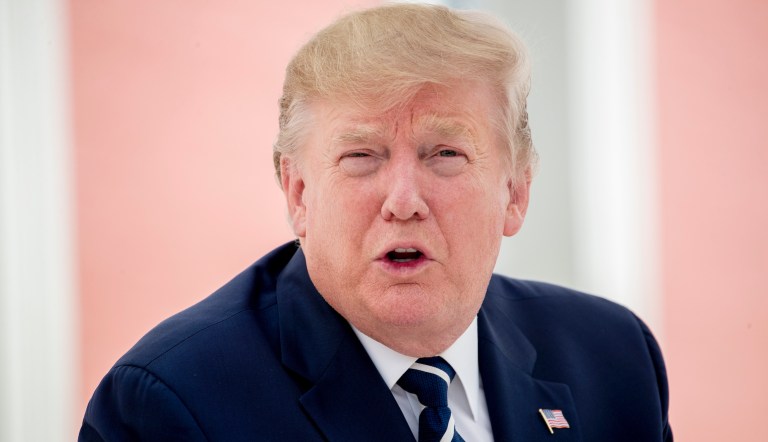 U.S President Donald Trump talks to the media as he sits for lunch with French President Emmanuel Macron at the Hotel du Palais in Biarritz, south-west France, Saturday Aug. 24, 2019.