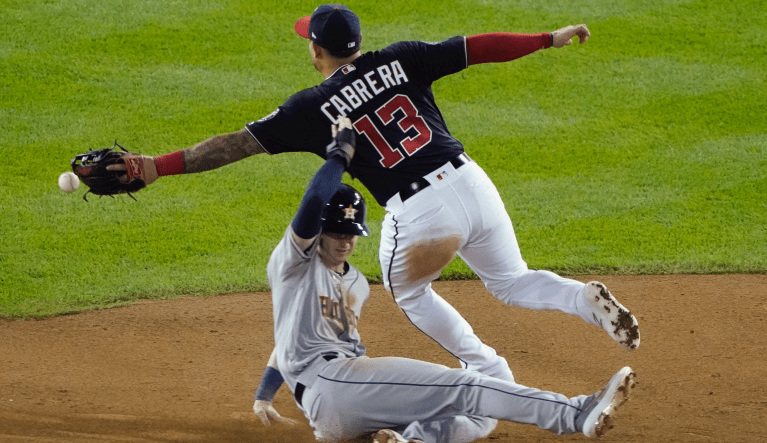 Houston Astros' Kyle Tucker steals second as Washington Nationals' Asdrubal Cabrera can't handle the throw during the sixth inning of Game 3 of the baseball World Series Friday, Oct. 25, 2019, in Washington. Tucker advanced to third. (AP Photo/Alex Brandon)