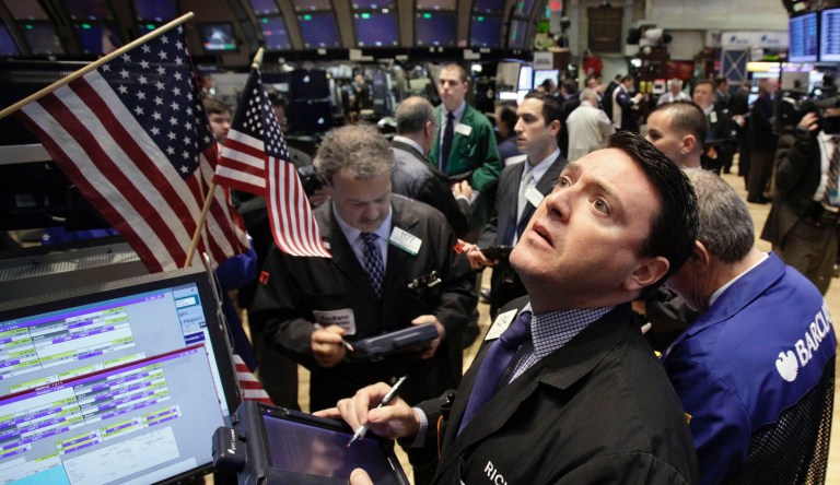 Traders work on the floor of the New York Stock Exchange, Monday, April 16, 2012, in New York. The Dow Jones industrial average rose but other stock indexes fell early Monday as a strong report on retail sales didn't dispel worries about the economy.