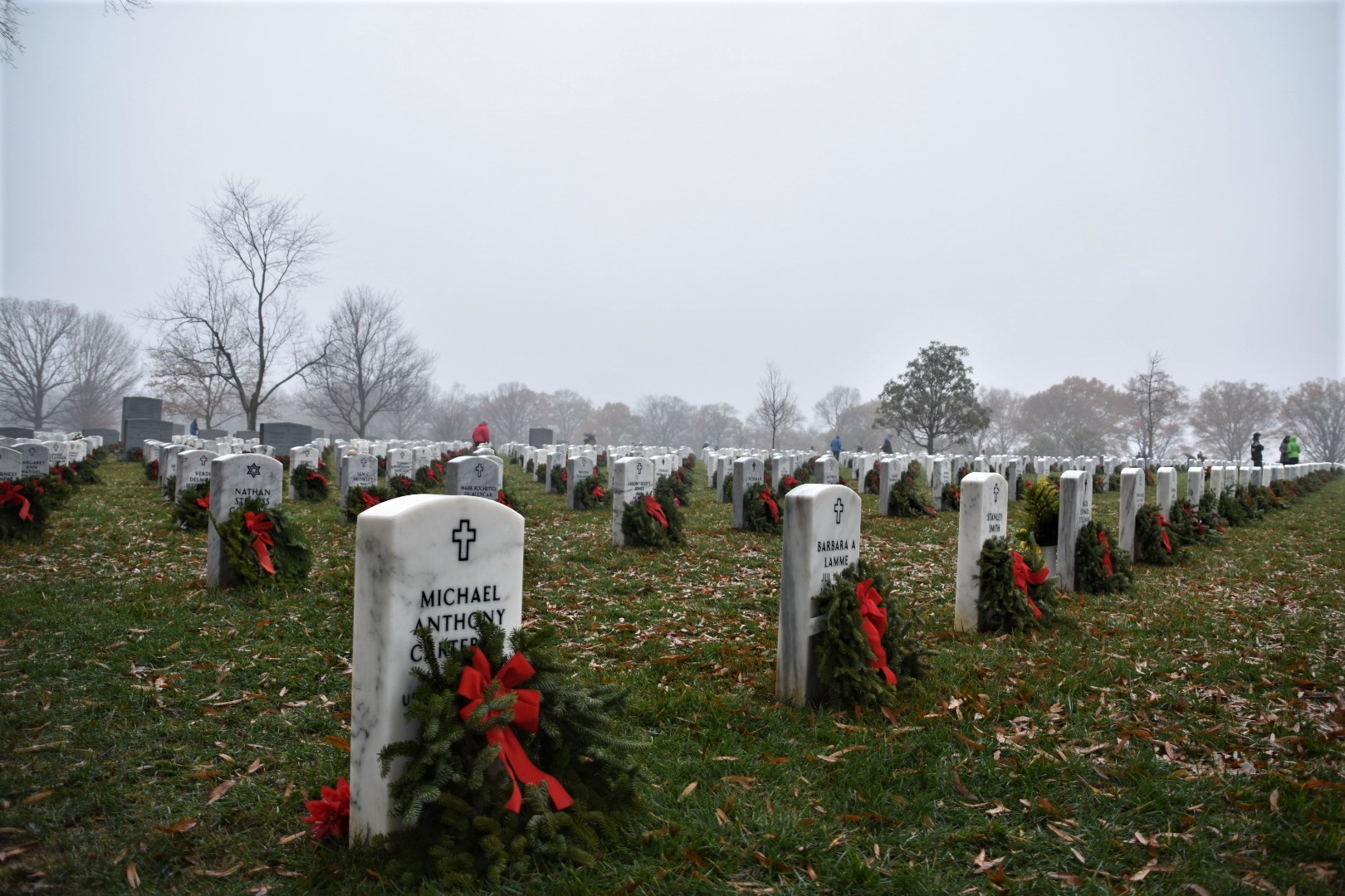 ‘Paying our respects’: Volunteers lay holiday wreaths at Arlington National Cemetery
