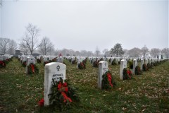 ‘Paying our respects’: Volunteers lay holiday wreaths at Arlington National Cemetery