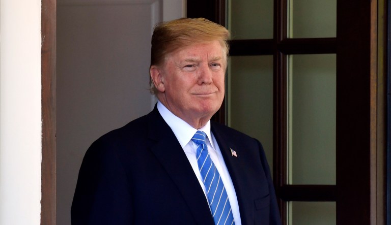 President Donald Trump waits to welcome Dutch Prime Minister Mark Rutte to the West Wing of the White House in Washington, Monday, July 2, 2018.
