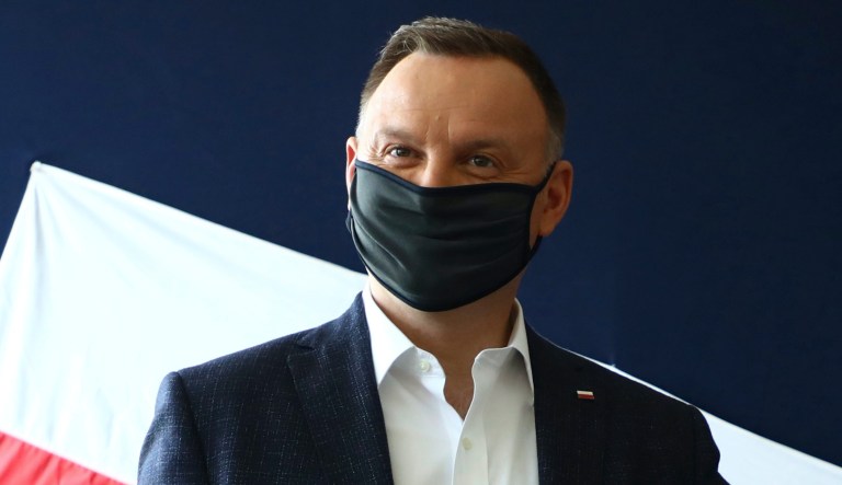 File picture taken June 28, 2020 shows Poland's President Andrzej Duda casting his vote during presidential election in Krakow, Poland. Duda has tested positive for COVID-19.                                                                          