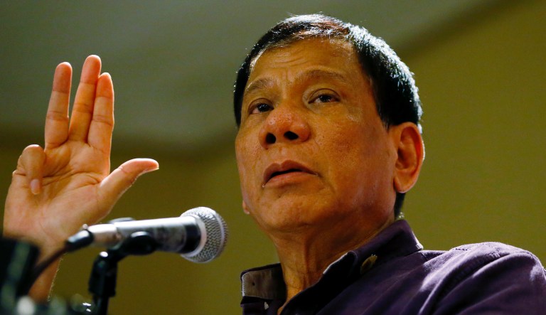 In this Nov.30, 2015 photo, Davao City Mayor Rodrigo Duterte gestures as he addresses supporters during his proclamation as the PDP-Laban Party's standard-bearer for the May 9, 2016 presidential elections in Manila, Philippines.