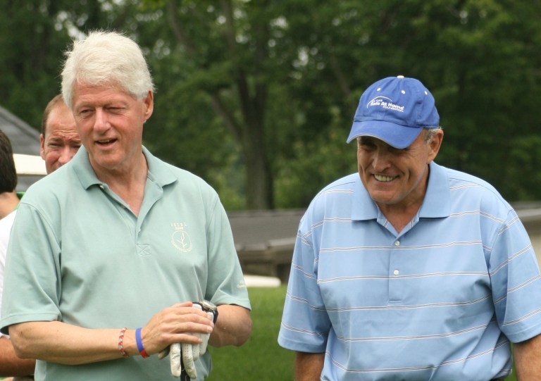 Bill Clinton and Rudy Giuliani attend the 2008 Joe Torre Safe at Home Foundation Golf Classic at Trump National Golf Club on July 14, 2008 in Briarcliff Manor, New York. (Photo by Rick Odell/Getty Images)