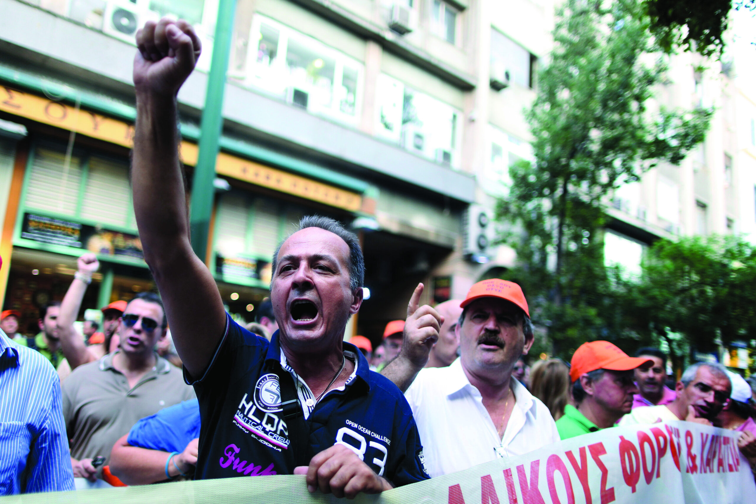 Spain, Greece launch austerity plans to secure aid