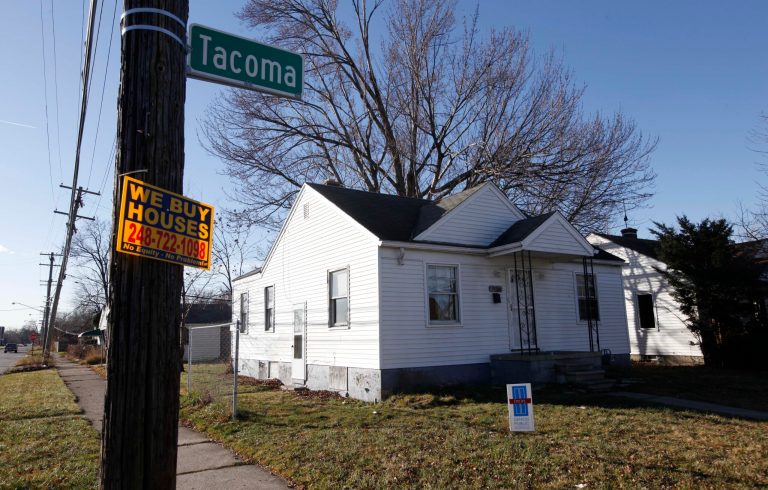   The exterior of a house in the 15300 block of Tacoma Street is shown in Detroit, Wednesday, Dec. 5, 2012. Detroit police say they've found the bodies of two men, a teenage boy and a woman who were apparently shot in this house on the city's east side. In an email, police Sgt. Eren Stephens says the bodies of one woman and three men, all in their 20s, were found about 9:15 p.m. Tuesday. Stephens says 