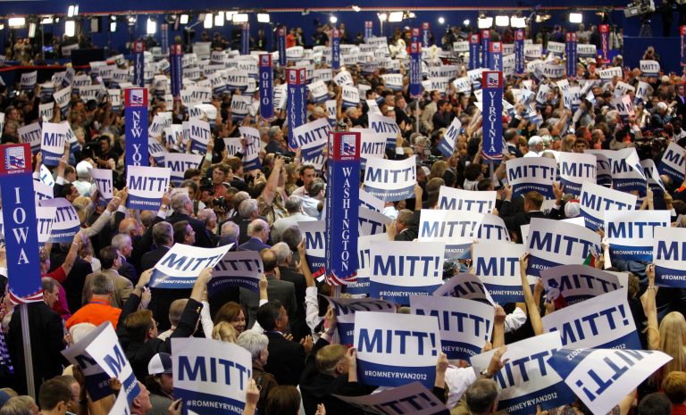 Delegates hold up Mitt Romeny placards as Romney is nominated for the Office of the President of the United Statesduring the Republican National Convention in Tampa, Fla., on Tuesday, Aug. 28, 2012. (AP Photo/Lynne Sladky)