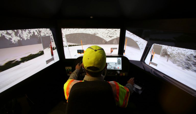   Driver Terence Mundt operates a snowplow simulator during a North Texas Tollway Authority training class in Plano, Texas, Thursday, Nov. 15, 2012. The NTTA is using the computer generated simulator to help snowplow operators become better at handling slick roads in a region not used to ice and snow. Highway officials in at least nine states are using the sophisticated simulator to give plow drivers a chance to practice snow removal in any weather. It works like a video game, recreating slick pavement, poor visibility and even children or animals bolting across the road.(AP Photo/LM Otero)  