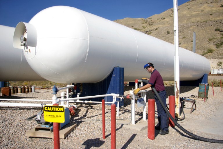 A worker fills his truck with natural gas. (iStock)