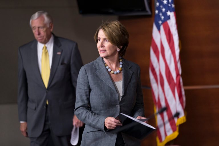 House Minority Leader Nancy Pelosi, D-Calif., joined by Minority Whip Steny Hoyer, D-Md., left, arrives at a news conference to discuss the government shutdown and their disagreement with Speaker of the House John Boehner, R-Ohio, at the Capitol in Washington, Saturday, Oct. 5, 2013. There has been no sign of progress toward ending an impasse that has idled 800,000 federal workers and curbed services around the country. (AP Photo/J. Scott Applewhite)