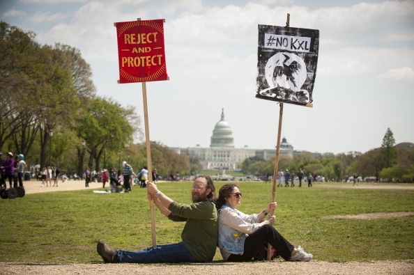 Opponents of the Keystone XL pipeline join the Cowboy and Indian Alliance in a rally on the National Mall in Washington, D.C., U.S., on Saturday, April 26, 2014. (Pete Marovich/Boomberg)