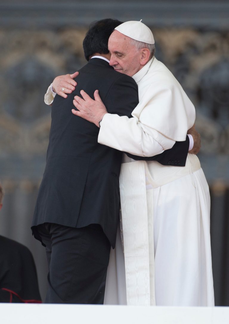 Pope Francis embraces Paul Bhatti, brother of the assassinated member of the Pakistani National Assembly Shahbaz Bhatti, on the occasion of a Pentecostal vigil in St. Peter Square at the Vatican, Saturday, May 18, 2013.(AP Photo/Alessandra Tarantino)
