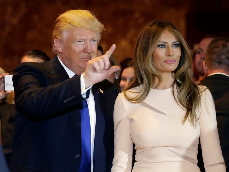 Republican presidential candidate Donald Trump, left, waves as he stands with his wife Melania Trump before speaking at a New York primary night campaign event, Tuesday, April 19, 2016, in New York. (AP Photo/Julie Jacobson)