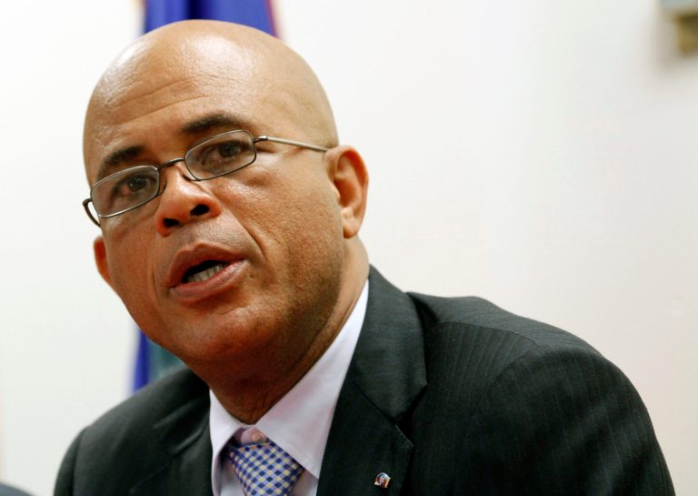   President Michel Martelly talks to reporters during a news conference, Monday, Dec, 10, 2012, in North Miami Beach, Fla. Martelly met with members of the Haitian-American community during his visit to South Florida. Haiti's government has been pitching business and tourism opportunities in the Caribbean country to Haitians living abroad, along with international investors. (AP Photo/Alan Diaz)  