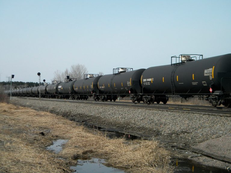 An oil-tank train with crude oil from the Bakken shale fields of North Dakota travels near Staples, Minn. (AP/Mike Cronin)