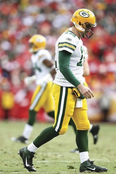 KANSAS CITY, MO-DECEMBER 18: Quarterback Aaron Rodgers#12 of the Green Bay Packers walks off the field during the game against the Kansas City Chiefs on December 18, 2011 at Arrowhead Stadium in Kansas City, Missouri.(Photo by Jamie Squire/Getty Images)