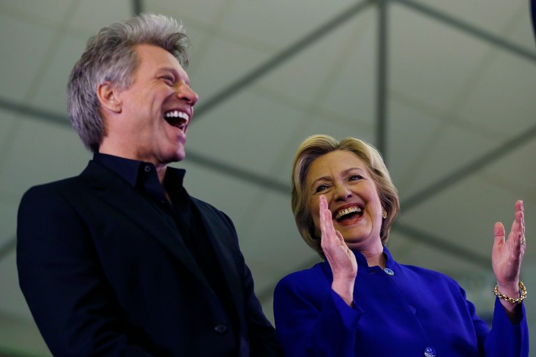 Democratic presidential candidate Hillary Clinton stands on stage with musician Bon Jovi during a campaign stop in Newark. Clinton said that she was 