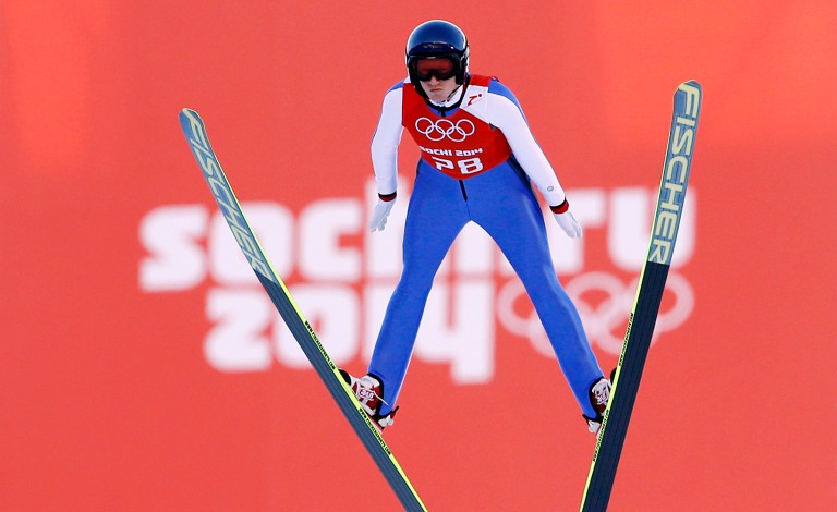 Austria's Daniela Iraschko-Stolz soars through the air during a women's ski jumping training session at the 2014 Winter Olympics, Saturday, Feb. 8, 2014, in Krasnaya Polyana, Russia. (AP Photo/Matthias Schrader)