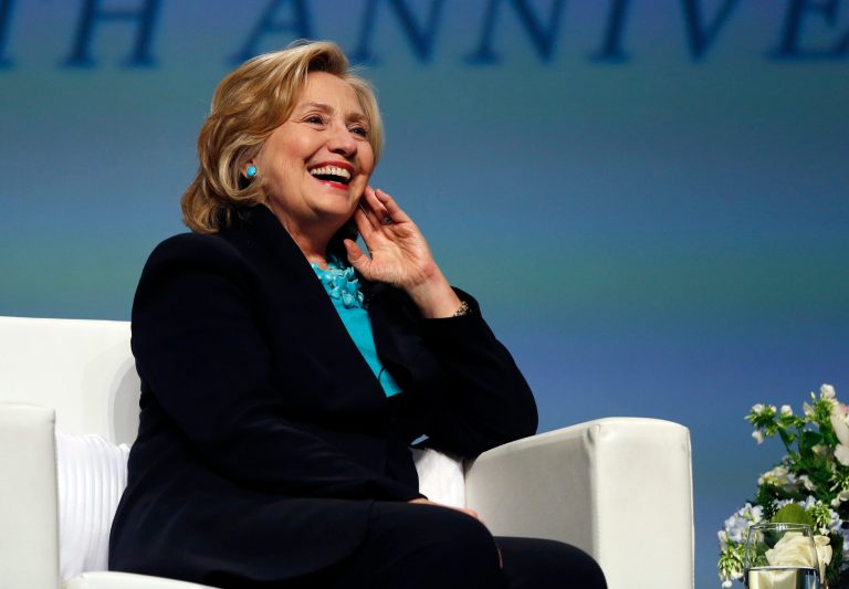 In this Dec. 4, 2014 file photo, former Secretary of State Hillary Clinton laughs in Boston. (AP Photo/Elise Amendola, File)