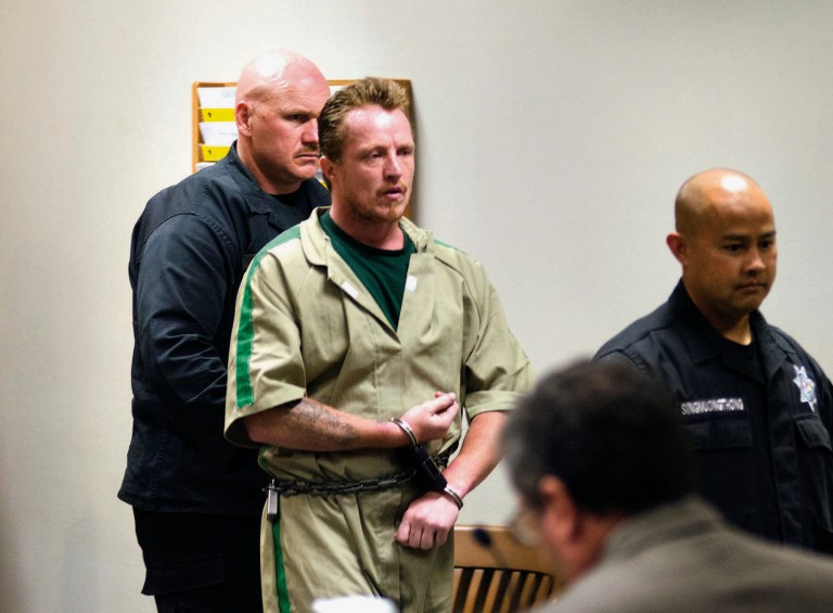 Nicholas Sheley, convicted of murder in May 2014 for fatally beating three adults and a 2-year-old with a hammer in a northwest Illinois apartment, is escorted into the Whiteside County courtroom, Monday, Aug. 11, 2014, for sentencing in the June 2008 killings. Sheley was sentenced to four consecutive life sentences. The killings were part of a series of eight murders authorities say Sheley committed in the summer of 2008, stretching from his hometown of Sterling, Illinois, south to St. Louis.  He next faces trial in Missouri, where prosecutors can pursue the death penalty in the deaths of Jill and Tom Estes, a Sherwood, Arkansas, couple who were traveling in that state. (AP Photo/The Telegraph, Alex T. Paschal, Pool)