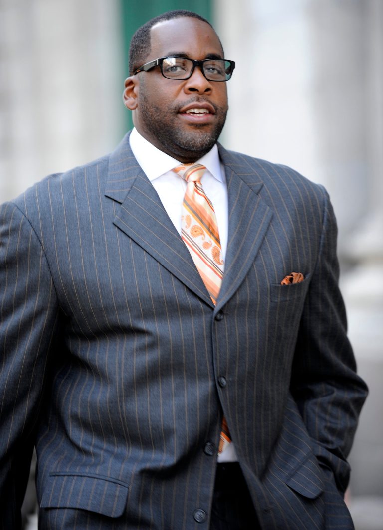   FILE - In this Sept. 27, 2012 file photo, former Detroit mayor Kwame Kilpatrick makes his way to U.S. Federal Court in Detroit. Businessman Karl Kado, who held contracts at Detroit's convention center, said Monday, Dec. 3, 2012 that he was a âhostageâ who felt compelled to pay thousands of dollars to then-Mayor Kwame Kilpatrick and his father or lose work. Kado told jurors that he personally delivered $5,000 to $10,000 to Kilpatrick âthree or four times.â He said he also delivered money through a top mayoral aide and separately paid $200,000 to $300,000 to Kilpatrick's father, Bernard. Kado is a crucial witness at the corruption trial, which began in September. (AP Photo/The Detroit News, David Coates)  
