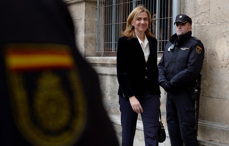 FILE - In this Feb. 8, 2014 file photo, Spain's Princess Cristina arrives at the courthouse in Palma de Mallorca, Spain after being named as a fraud and money laundering suspect. A Spanish judge on Wednesday June 25, 2014, has moved closer to indicting Princess Cristina, sister of newly proclaimed King Felipe, in a tax fraud and money laundering investigation centering on her husband. Wrapping up a four-year pre-trial investigation, Palma de Mallorca investigative magistrate Jose Castro kept Cristina on the list of suspects he thinks should stand trial, in her case for money laundering and tax fraud cooperation. (AP Photo/Manu Fernandez, File)