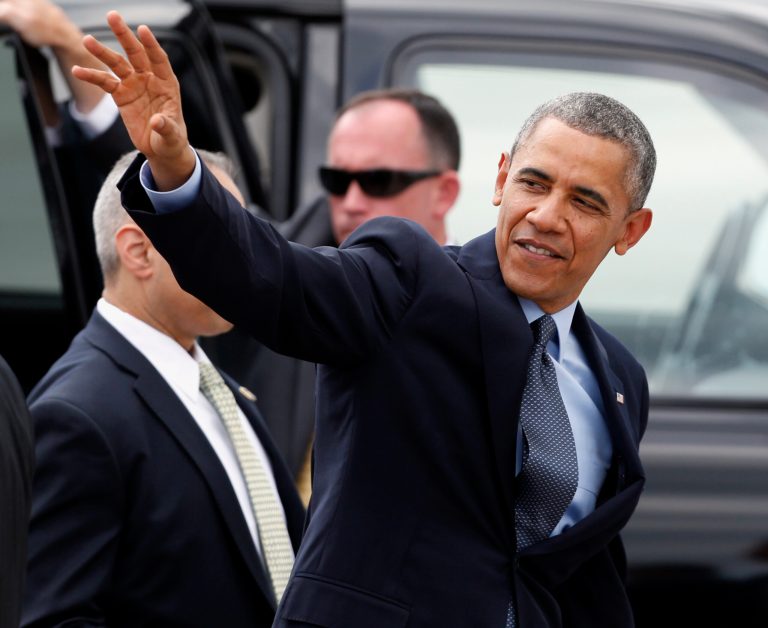 President Obama waves to people who greeted him after arriving at Griffiss International Airport in Rome, N.Y., on Thursday.(AP Photo/Mike Groll)