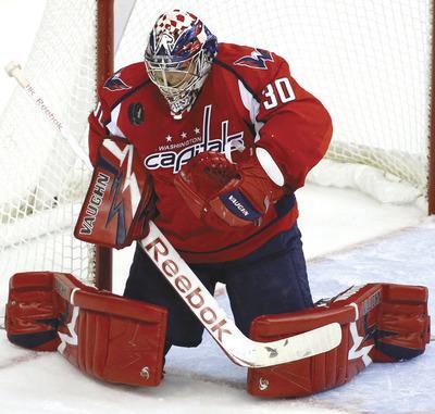 Luis M. Alvarez/AP
GoalkeeperMichal Neuvirth returned to the ice from injury and made 28 saves in Washington's home preseason victory over the Chicago Blackhawks on Sunday.