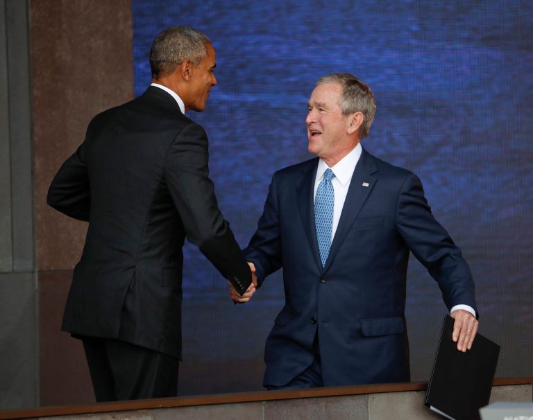President Barack Obama, left, and former President George W. Bush, right, shake hands following Bush's speech at the dedication ceremony for the Smithsonian Museum of African American History and Culture on the National Mall in Washington, Saturday, Sept. 24, 2016. Gallup said even their foes had more confidence in Bush and Obama than Democrats today have in President-elect Trump. (AP Photo/Pablo Martinez Monsivais)