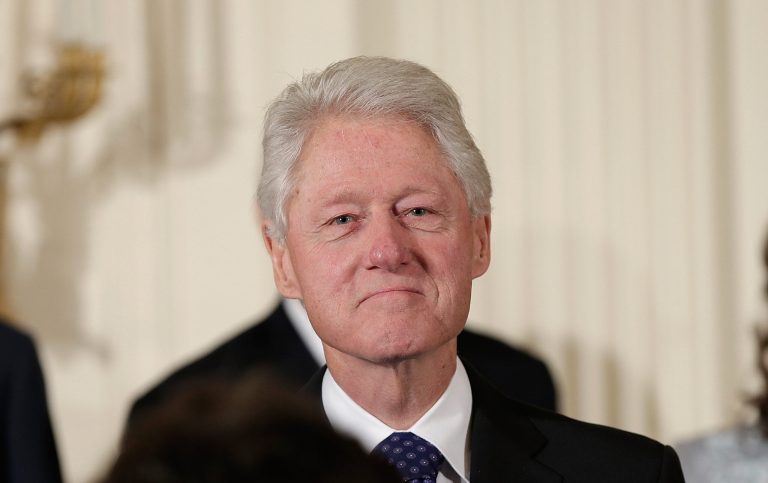 WASHINGTON, DC - NOVEMBER 20:  Former U.S. President Bill Clinton waits on stage before being awarded the Presidential Medal of Freedom in the East Room at the White House on November 20, 2013 in Washington, DC. The Presidential Medal of Freedom is the nation's highest civilian honor, presented to individuals who have made meritorious contributions to the security or national interests of the United States, to world peace, or to cultural or other significant public or private endeavors.  (Photo by Win McNamee/Getty Images)