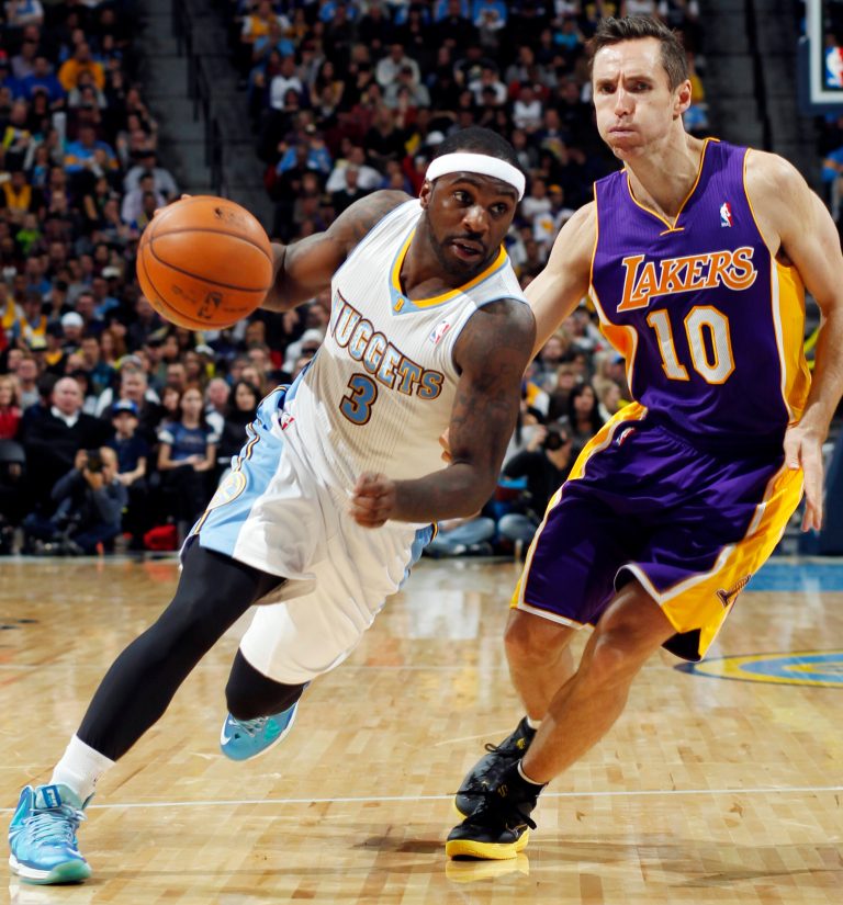   Denver Nuggets guard Ty Lawson (3) drives against Los Angeles Lakers guard Steve Nash in the fourth quarter of their NBA basketball game in Denver, Wednesday, Dec. 26, 2012. The Nuggets won 126-114. (AP Photo/David Zalubowski)  