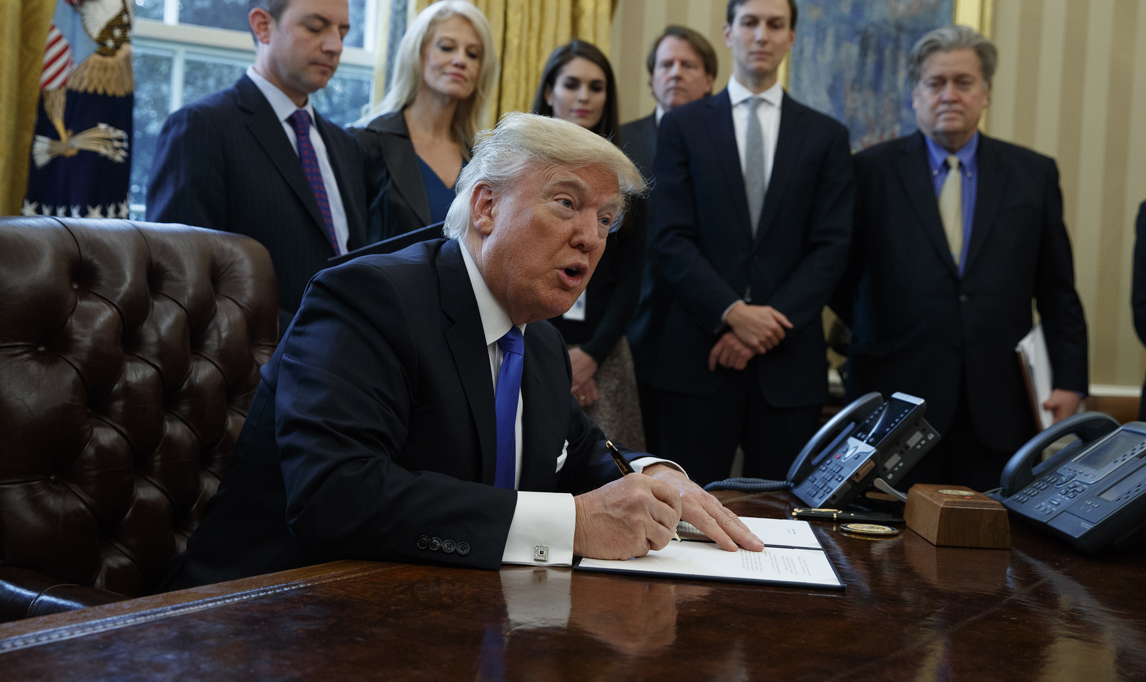 Rights groups slap Trump with lawsuit after refugees detained