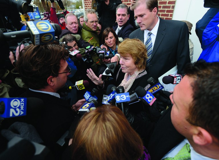 Former Penn State University President Graham Spanier's attorneys, Elizabeth Ainslie, center, and Edward Spreha, back right, talk to media at Harrisburg District Judge William Wenner's office Wednesday Nov. 7, 2012 following the arraignment. Spanier was arraigned and released on bail at the brief court appearance on charges he lied about and concealed child sex abuse allegations involving former assistant football coach Jerry Sandusky. (AP Photo/Jason Minick)