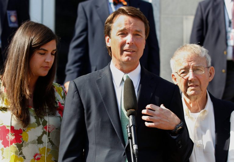   FILE - In a Thursday, May 31, 2012 file photo, former presidential candidate John Edwards speaks outside a federal courthouse as his daughter, Cate Edwards, left, and father Wallace Edwards, listen after his campaign finance fraud case ended in a mistrial, in Greensboro, N.C. Federal prosecutors on Wednesday, June 13, 2012 dropped all charges against Edwards after his corruption trial ended last month in a deadlocked jury. (AP Photo/Chuck Burton, File)  