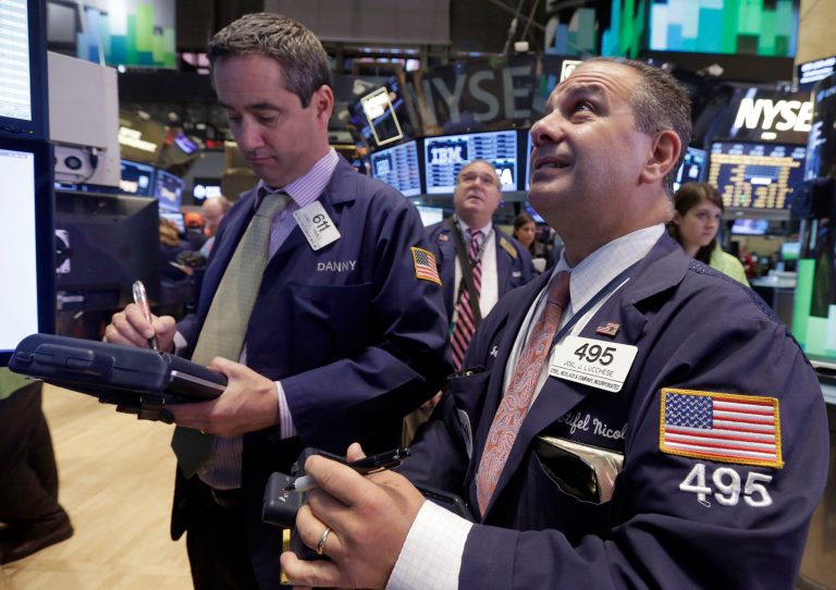 Traders work on the floor of the New York Stock Exchange, which is booming of late, on Nov. 13. (AP Photo/Richard Drew)