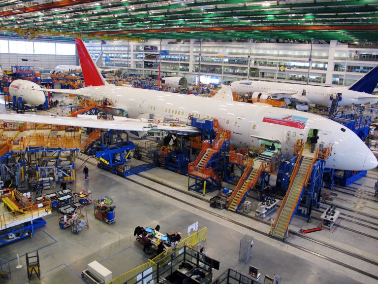 FILE - In this Thursday, Dec. 19, 2013, file photo, workers assemble Boeing 787 Dreamliners in the company's massive assembly plant in North Charleston, S.C.  Boeing reports quarterly financial results on Wednesday, Jan. 29, 2014. (AP Photo/Bruce Smith, File)
