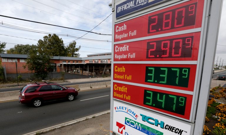 Gas prices below $3 dollars are displayed at a gas station. A sudden plunge in the price of oil is sending economic and political shockwaves around the world as oil exporting countries face the prospect of billions of dollars of lost revenue and importing nations get some relief in a time of slower economic growth. (AP Photo/Julio Cortez)