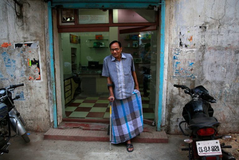 In this April 15, 2014 photo, India's Ramesh Agrawal walks outside his shop during an interview in Raigarh in Chhattisgarh state, India. Six environmental advocates from India, Peru, Russia and three other nations have won this year's Goldman Prize, which is awarded annually for grass-roots activism. Agrawal received the prize for helping villagers fight a large coal mine in Chhattisgarh state, the San Francisco-based Goldman Environmental Foundation said Monday. (AP Photo/Rafiq Maqbool)
