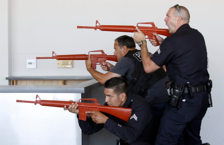 In this Oct. 6, 2013 photo, Los Angeles Airport Police team up with City of Los Angeles Police officers in a joint training session on counterterrorism in Ontario, Calif. After spending a decade sending military equipment to civilian police departments across the United States, Washington is reconsidering the idea in light of the violence in Ferguson, Mo., amid images of heavily-armed police, snipers trained on protesters and tear gas plumes. (AP Photo/Alex Gallardo)