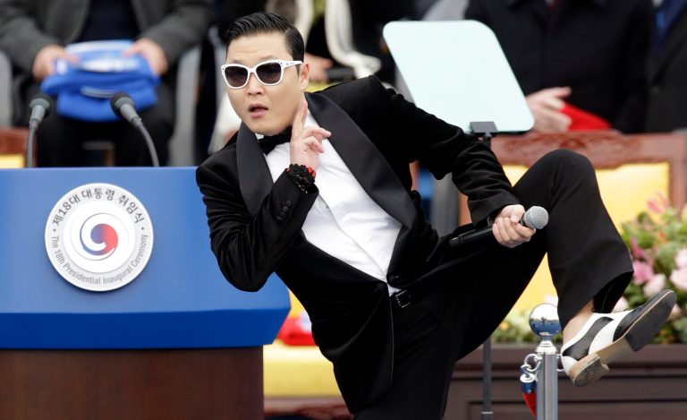 FILE - In this Feb. 25, 2013 file photo, South Korean rapper PSY performs before President Park Geun-hye's presidential inauguration ceremony at the National Assembly in Seoul, South Korea. Sporting a black suit and a sleek haircut, a 7-year-old boy, Hwang Min-woo performed at a news conference in South Korea on Wednesday, March 6, 2013. The impish boy nicknamed 
