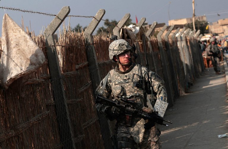 Lt. Andrew Minoski of Las Vegas, Nevada of the U.S. Army's 172nd Brigade Combat Team leads a patrol of soldiers January 19, 2009 in Musayyib, in the Babil Province, Iraq. (Photo by Chris Hondros/Getty images)