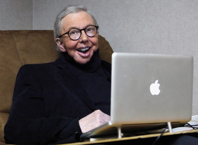 FILE - In this Jan. 12, 2011 file photo, Pulitzer Prize-winning movie critic Roger Ebert works in his office at the WTTW-TV studios in Chicago. Ebert died on Thursday, April 4, 2013. He was 70. Ebert started out as an old-school newspaper man, the kind that has all but vanished: a fierce competitor who spent the day trying to scoop the competition and the night bellied up to the bar swapping stories. Then newspapers fell on hard times, either laying off huge chunks of their staffs or disappearing altogether. But Ebert didn't merely survive. He flourished, largely by embracing television and later the Internet and social networks. (AP Photo/Charles Rex Arbogast, File)