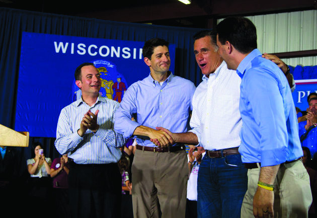 In this June 18, 2012, photo RNC chairman Reince Priebus, right, Rep. Paul Ryan, R-Wis., Republican presidential candidate, former Massachusetts Gov. Mitt Romney, and Gov. Scott Walker, R-Wis., left, arrive at a campaign event in Janesville, Wis. (AP Photo/Evan Vucci)