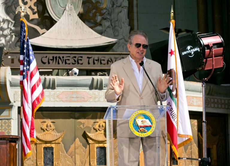 Actor Warren Beatty speaks at a ceremony at which Gov. Jerry Brown signed California Assembly Bill AB 1839, the Expanded Film and Television Job Creation Act, in front of the TCL Chinese Theatre in Los Angeles on Thursday, Sept. 18, 2014. The legislation more than triples the state's tax credit to $330 million a year for films and TV shows produced in the state. (AP Photo/Damian Dovarganes)