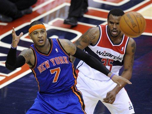 New York Knicks forward Carmelo Anthony (7) looks for the ball against Washington Wizards forward Trevor Booker (35) during the second half of an NBA basketball game on Friday, Jan. 6, 2012, in Washington. The Knicks won 99-96. (AP Photo/Nick Wass)
