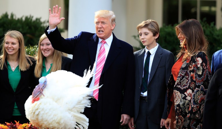 President Trump with first lady, Melania Trump, right, and their son, Barron Trump, waves after pardoning the National Thanksgiving Turkey, Drumstick, during a ceremony in the Rose Garden of the White House in Washington, Tuesday, Nov. 21, 2017. This is the 70th anniversary of the National Thanksgiving Turkey presentation. (AP Photo/Manuel Balce Ceneta)