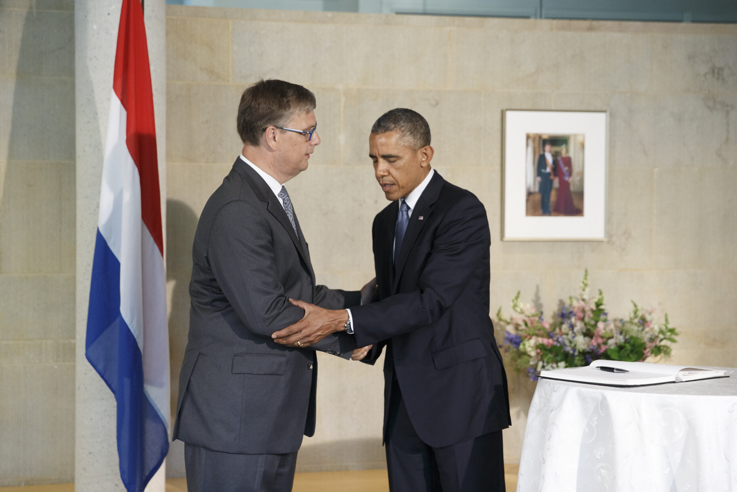 Obama pledges justice in visit to Dutch embassy