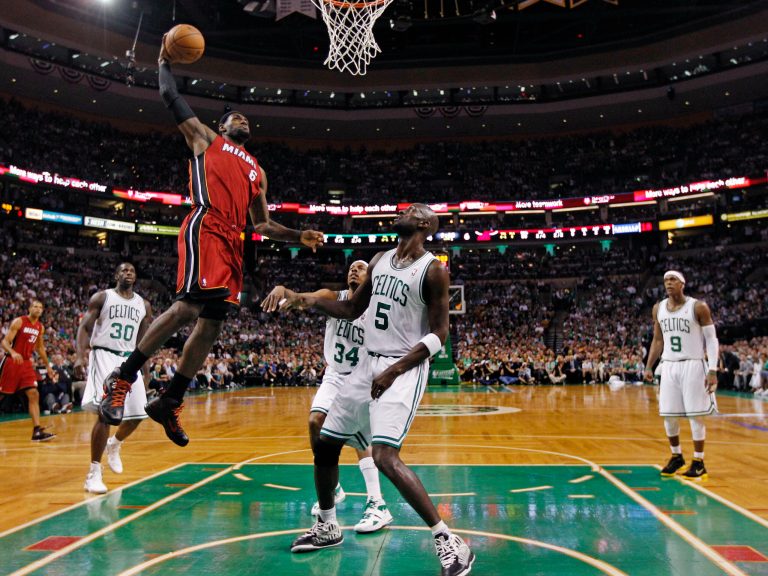   Miami Heat forward LeBron James (6) elevates for a dunk past Boston Celtics' Brandon Bass (30), Paul Pierce (34), Kevin Garnett (5) and Rajon Rondo (9) during the first half in Game 6 of the NBA basketball Eastern Conference finals, Thursday, June 7, 2012, in Boston. (AP Photo/Charles Krupa)  
