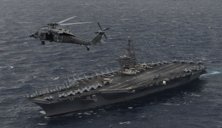 The Navy's 7th Fleet announced that the Nimitz Carrier Strike Group, along with its air wing, a cruiser and four destroyers, had entered the Indian Ocean-Western Pacific region on its way from its scheduled deployment in the Middle East to the carrier's home port in Bremerton, Wash. (U.S. Navy photo by Mass Communication Specialist 3rd Class Cole Schroeder)